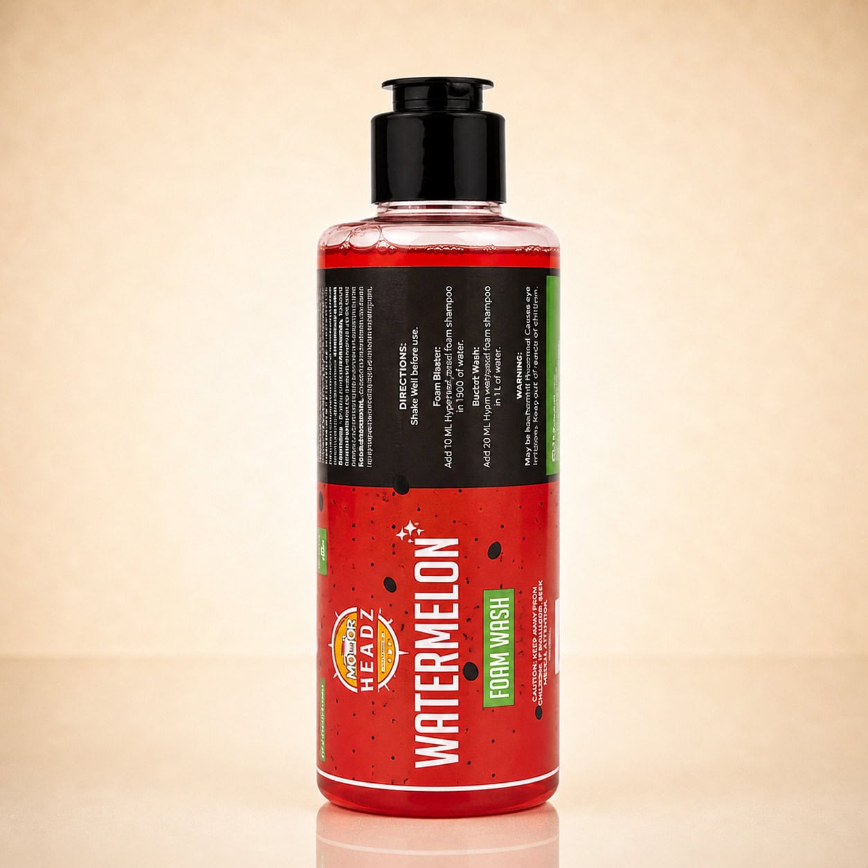 Watermelon Foam Wash Shampoo on a warm reflective studio background